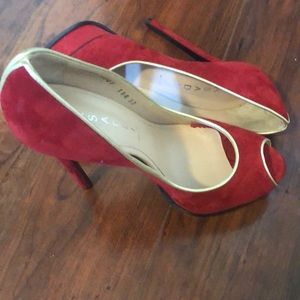 Cascadei, red gold trimmed suede high heels.